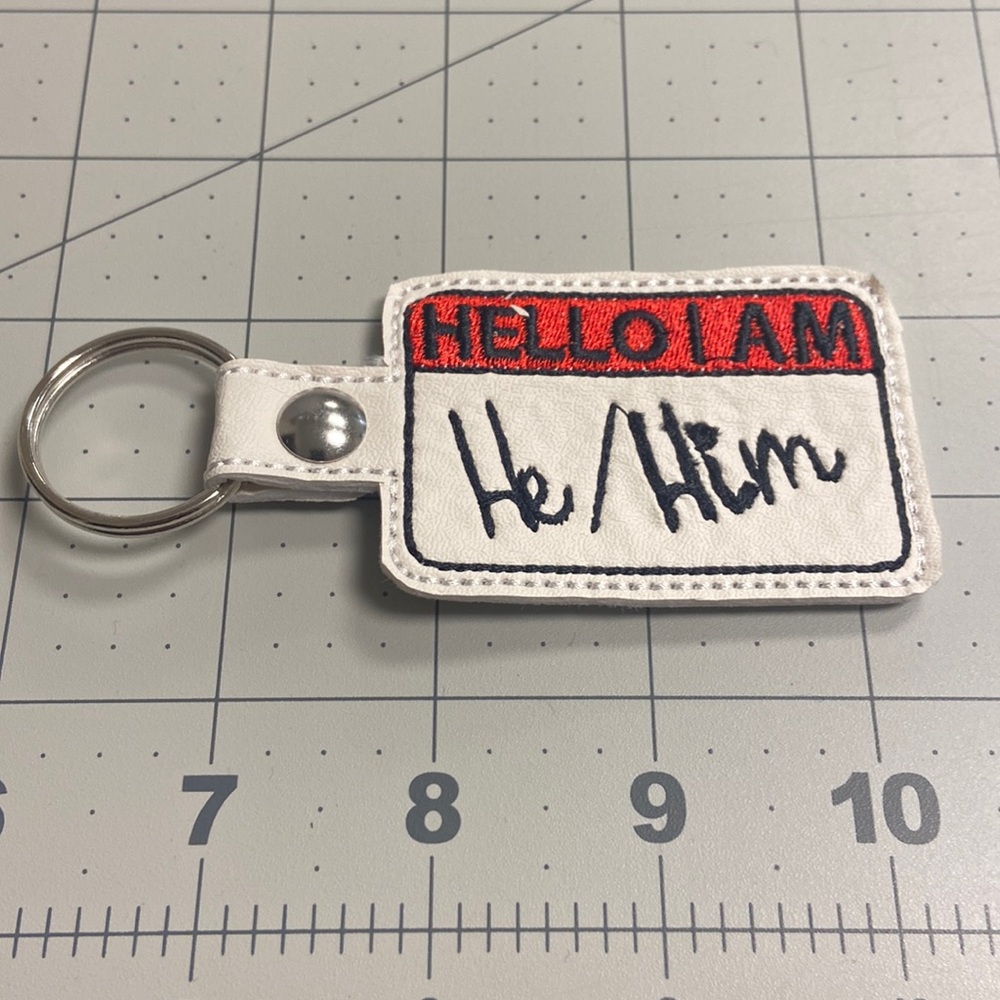 Handmade Embroidered Vinyl He/Him Key Fob